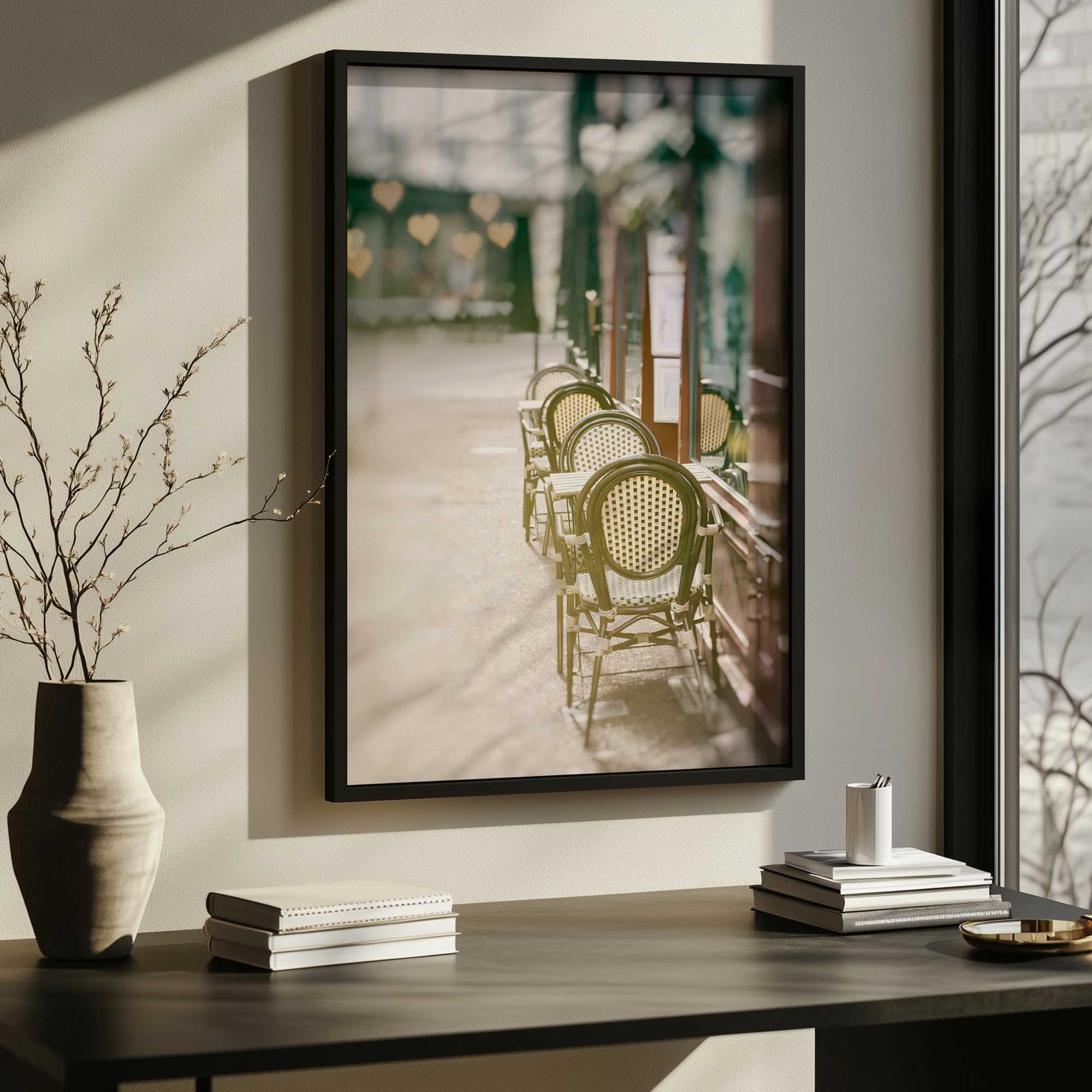 morning calm at the café art print in a black frame hanging over a desk