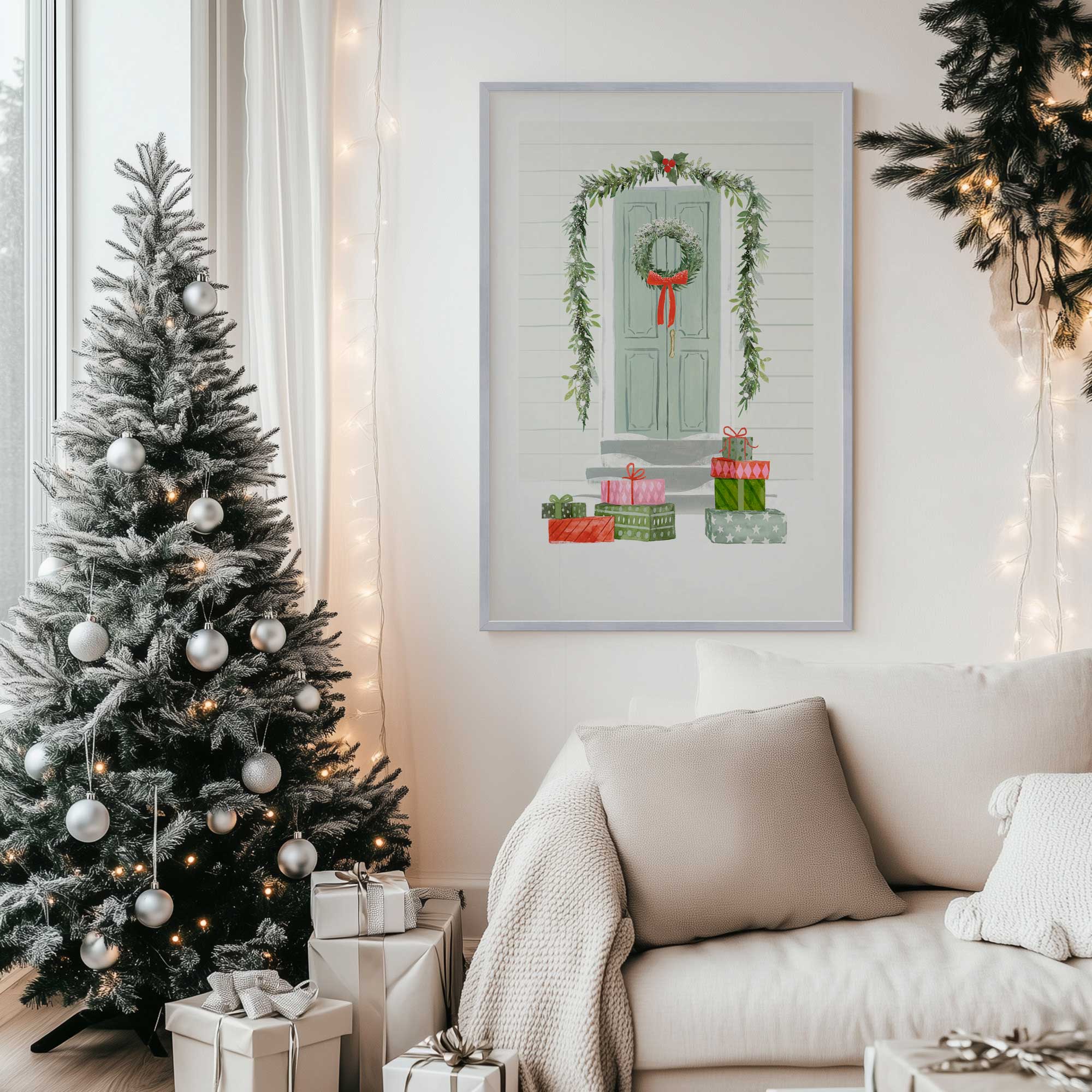 Festive Porch Surprise art print in a silver frame hanging by a Christmas tree