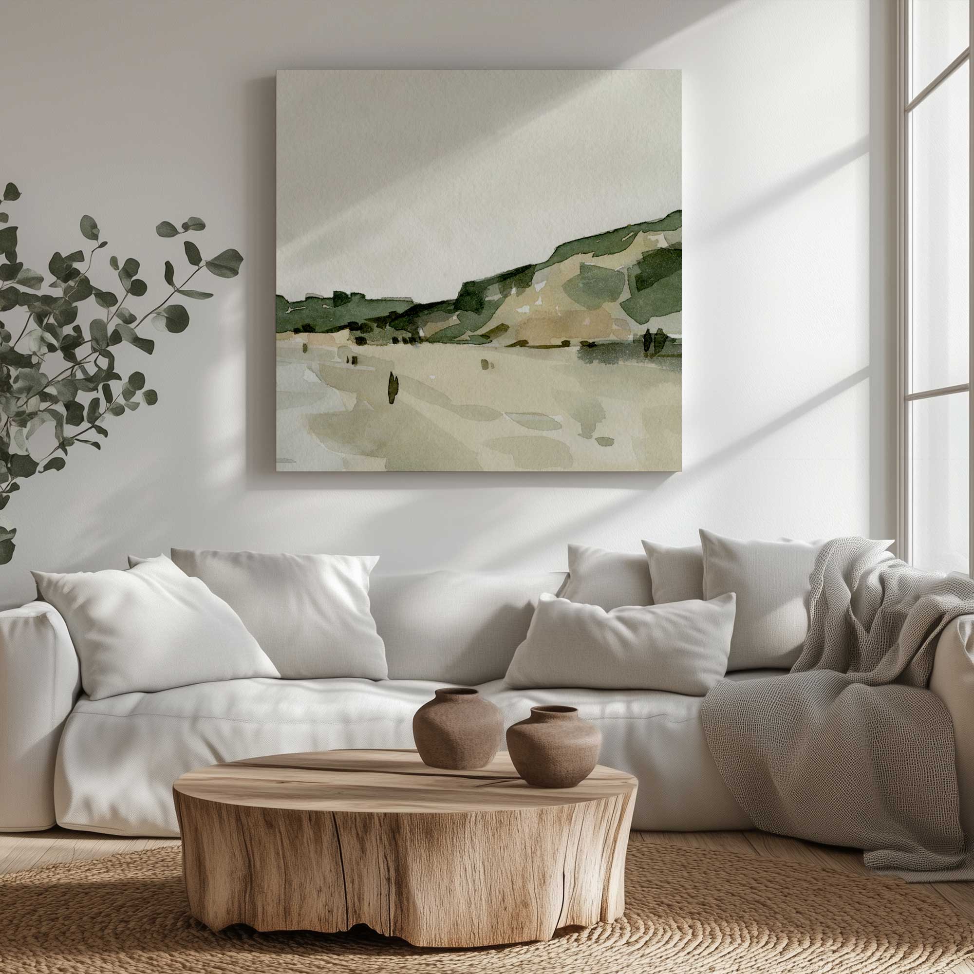soft sand and still skies II canvas print hanging above a white couch