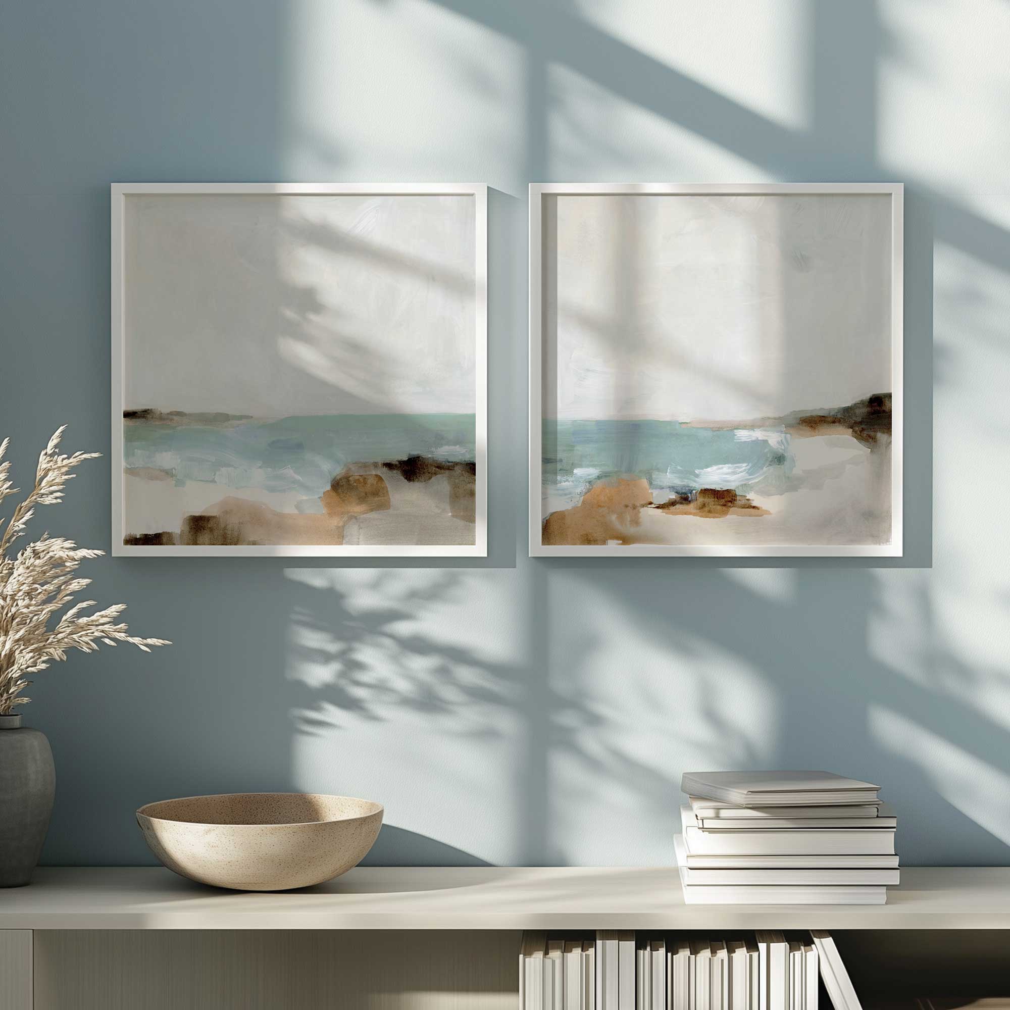 serene waves set of 2 framed art prints hanging in a coastal style living room