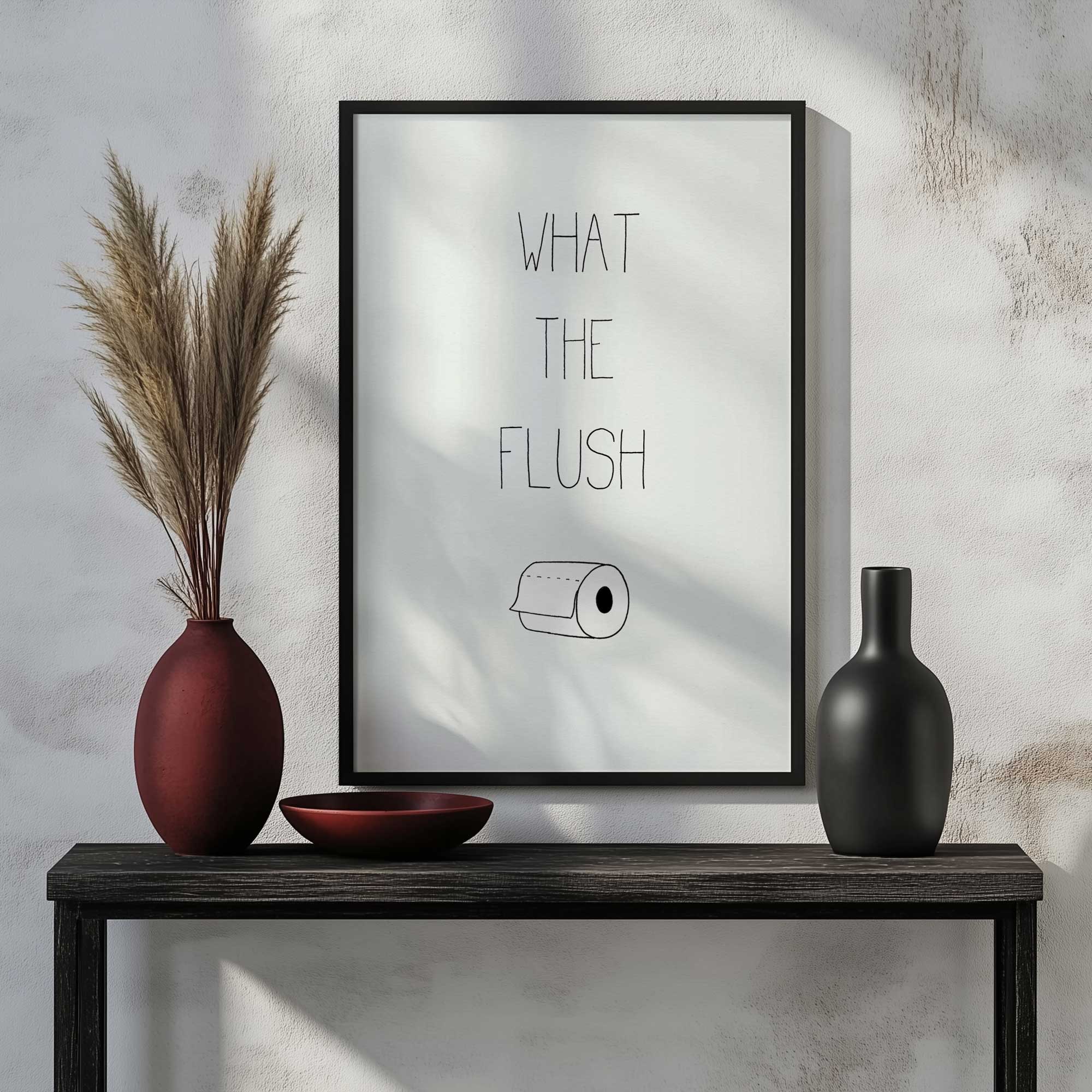 What the Flush art print hanging in a bathroom