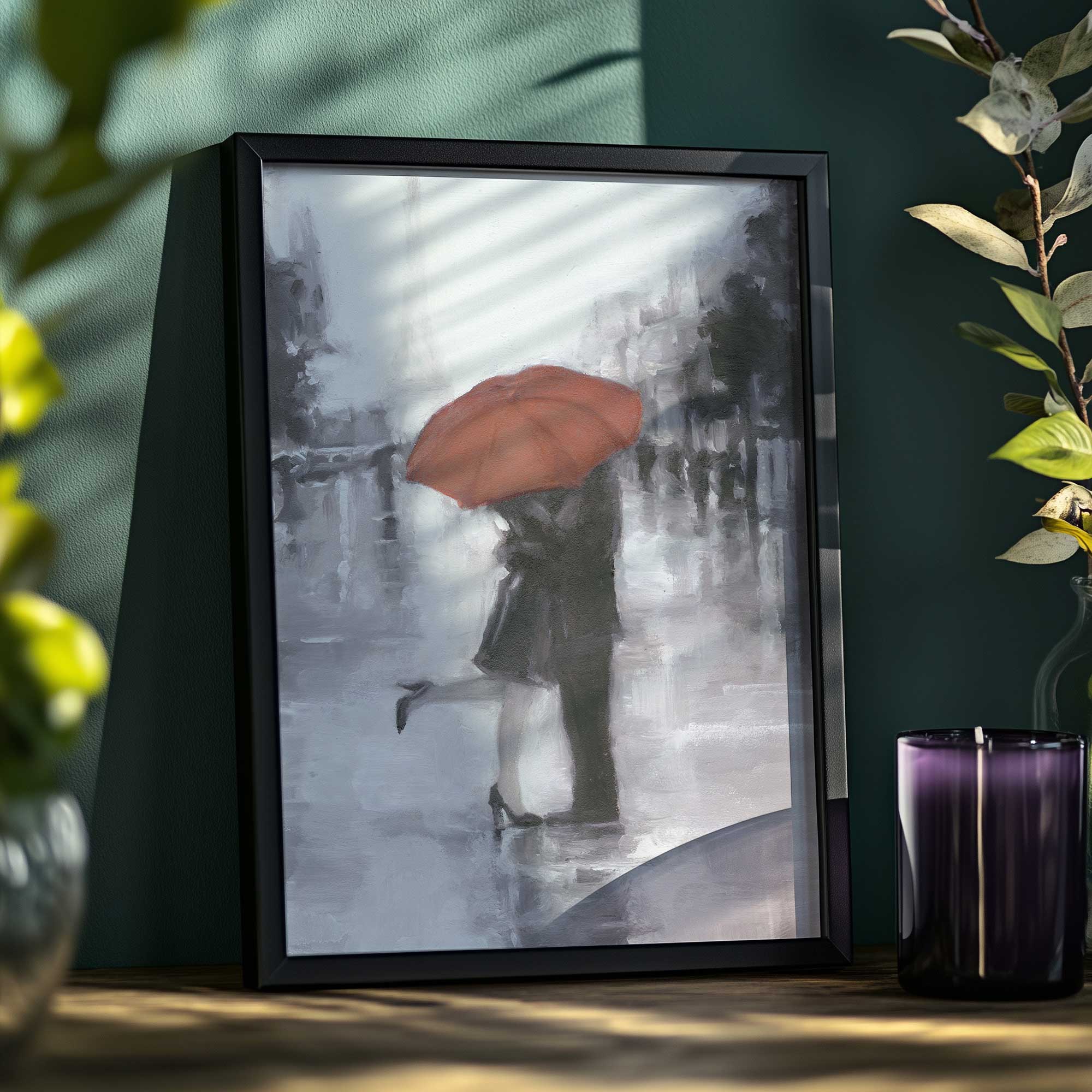 art print of a couple kissing in rain with red umbrella and eiffel tower framed print on a shelf