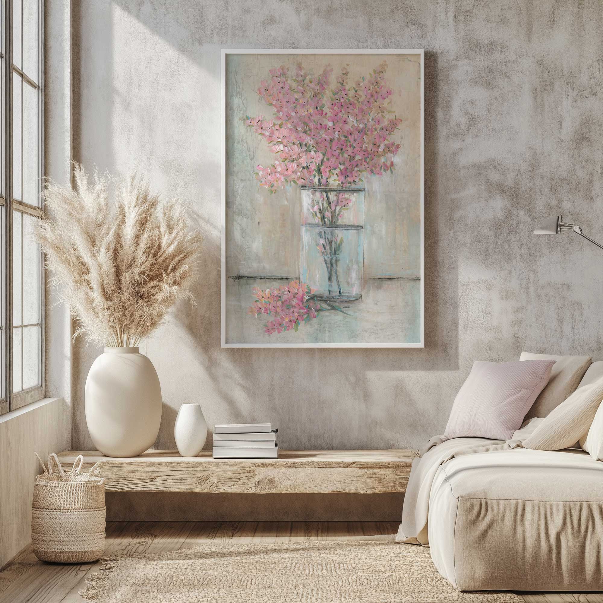 pink blossoms in a glass vase art print hanging in a smal rustic sitting room