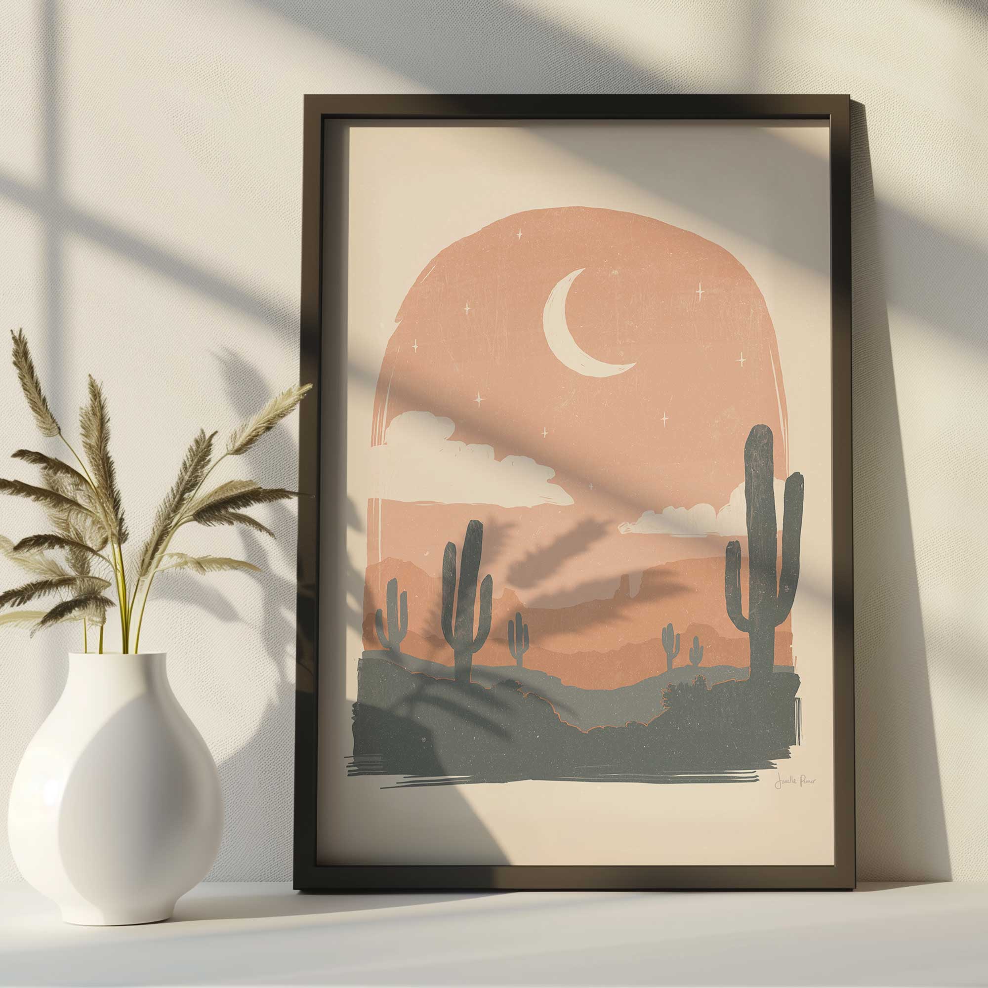 Moonlit Desert I art print in a black frame on a shelf