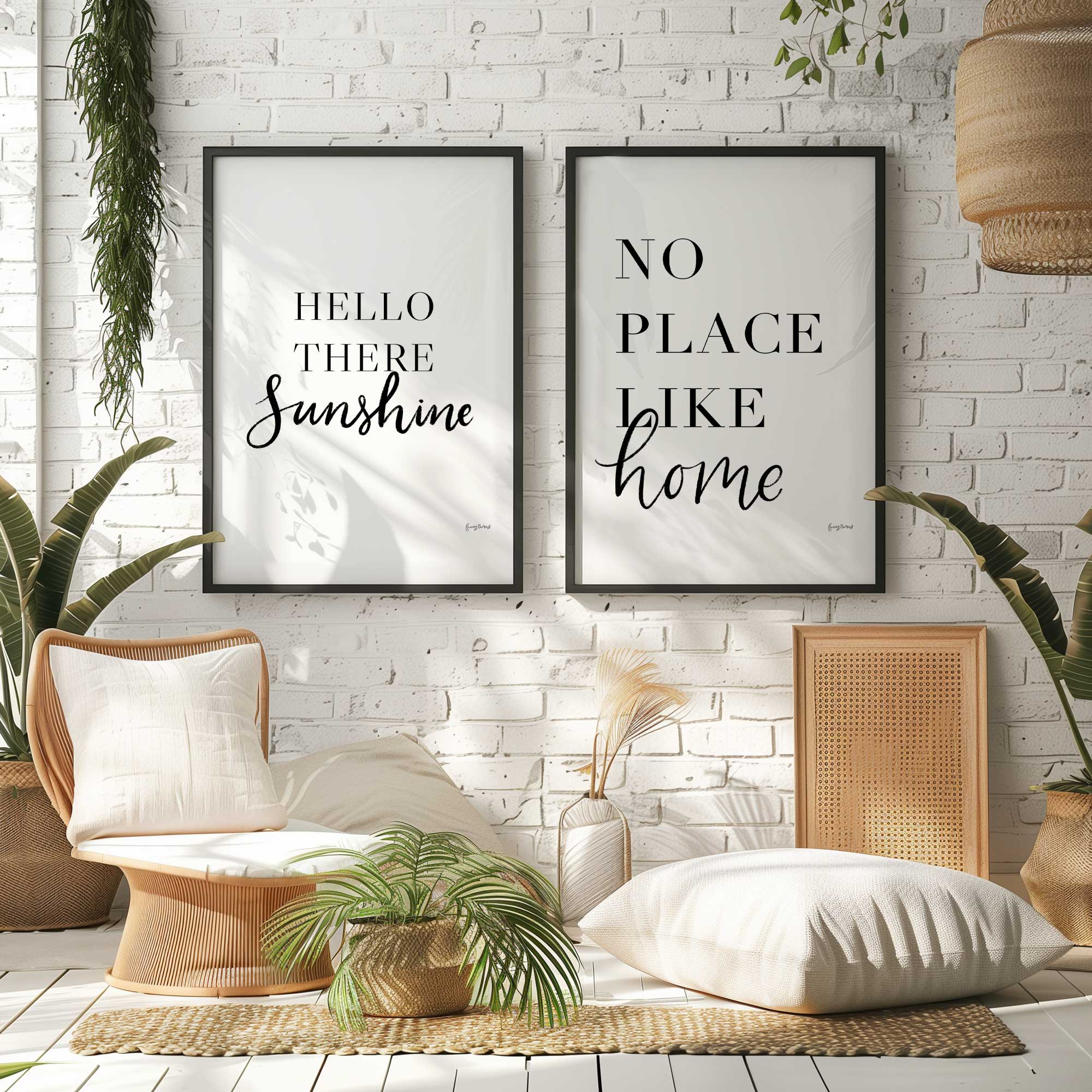 hello there sunshine and no place like home framed prints hanging in a boho style sitting room