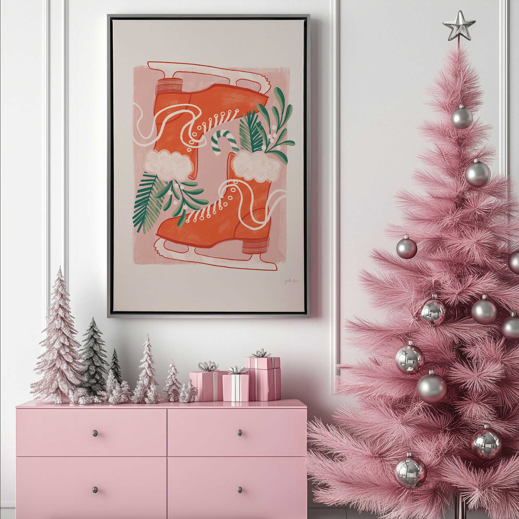 Candy cane skates canvas print in a silver floater frame hanging above a dresser beside a pink Christmas tree