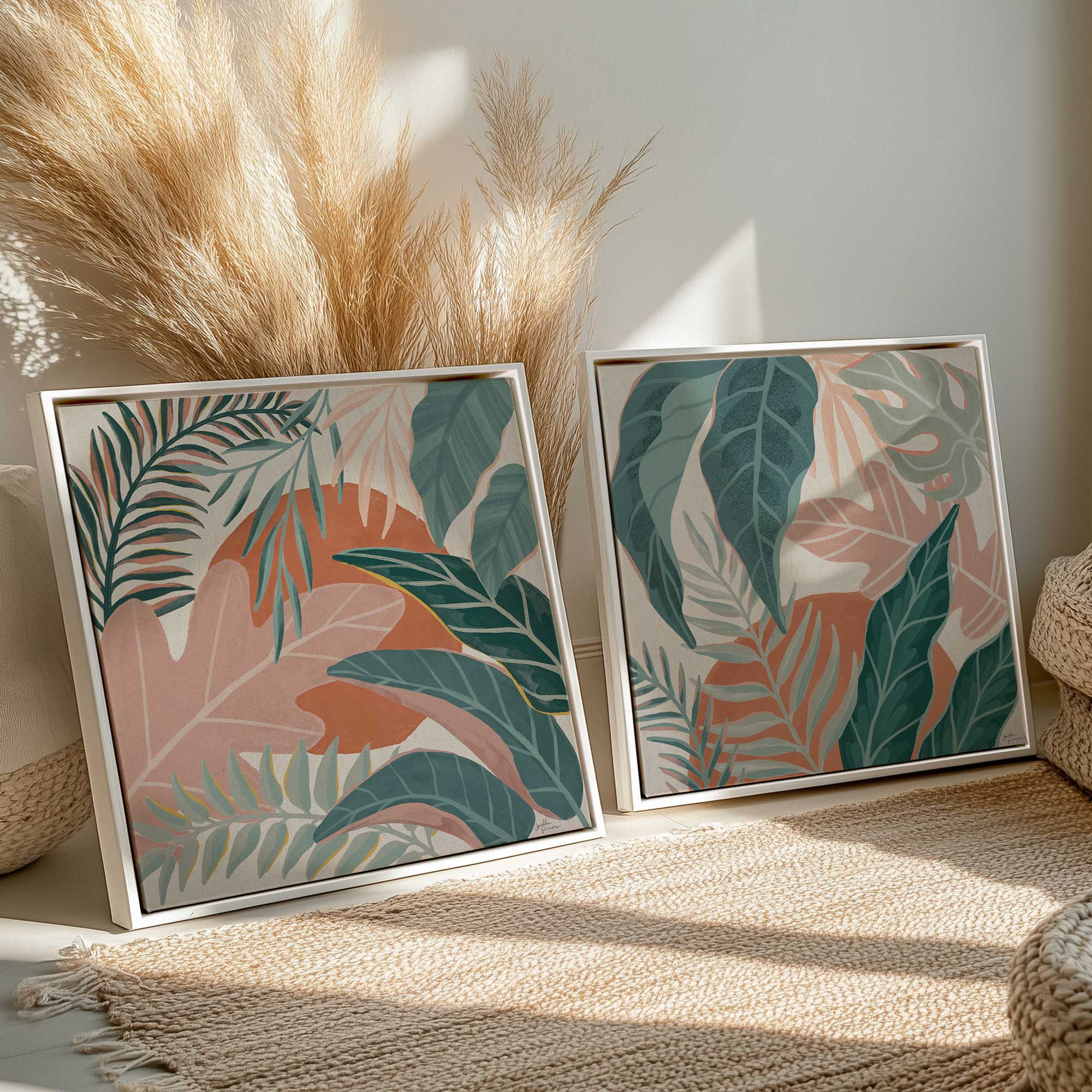 Tropical leaves set of 2 canvas prints in white floater frames leaning against a wall