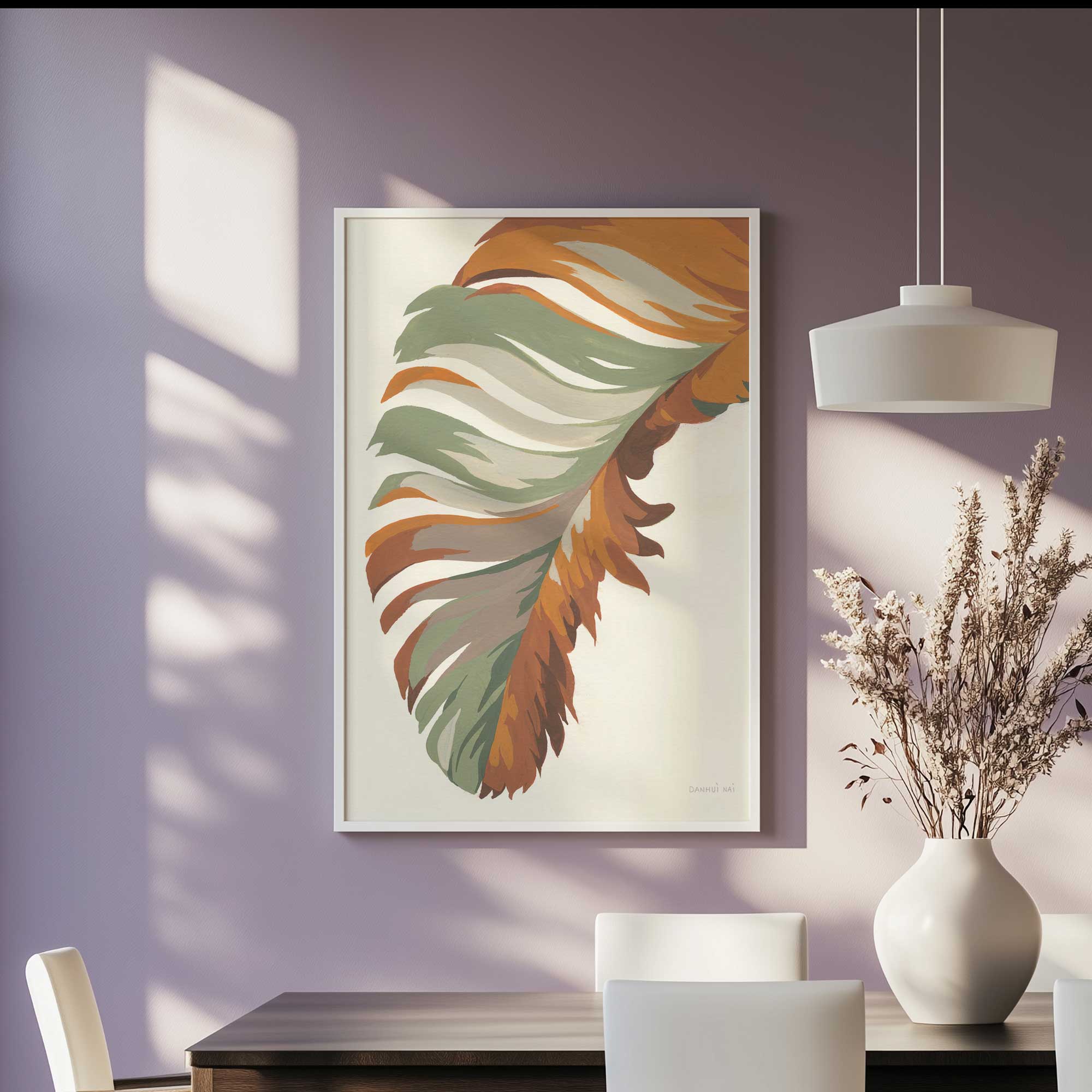 Earthy feather flow art print in a white frame hanging in a purple dining room