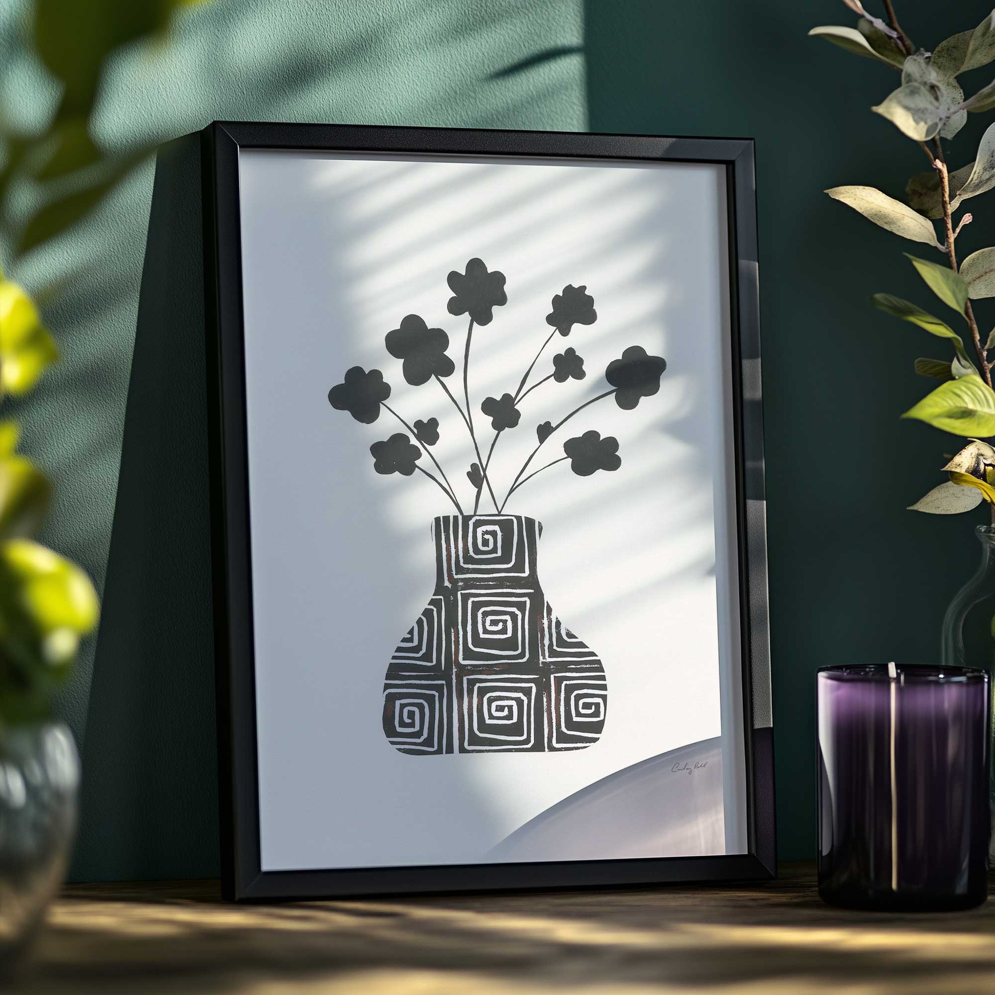 Swirls & Springs framed plant art print on a shelf