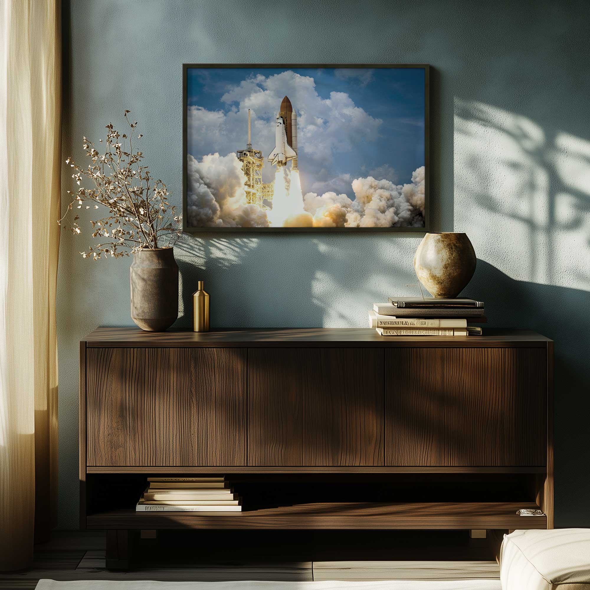 launch day paper print in a black frame hanging above a console table