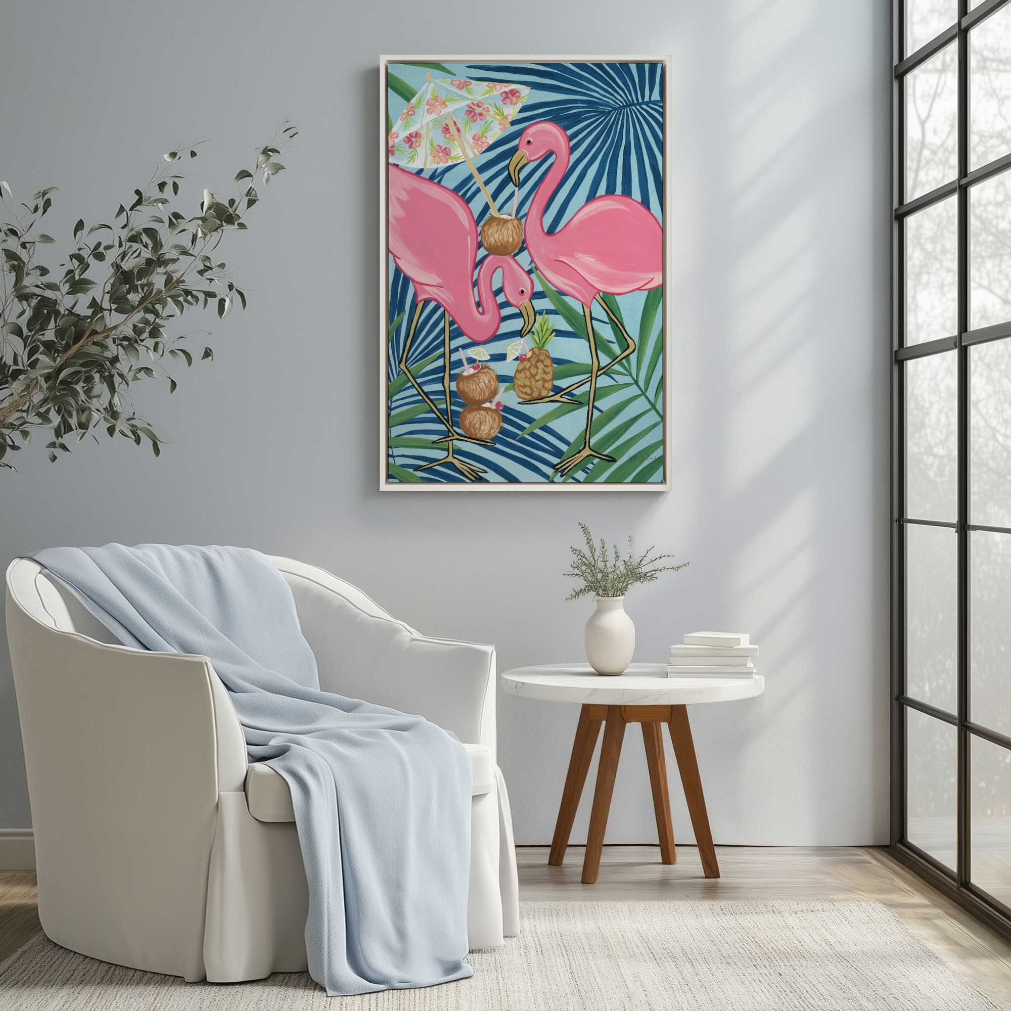 flamingo happy hour canvas print in a white floater frame hanging in a bright sitting room